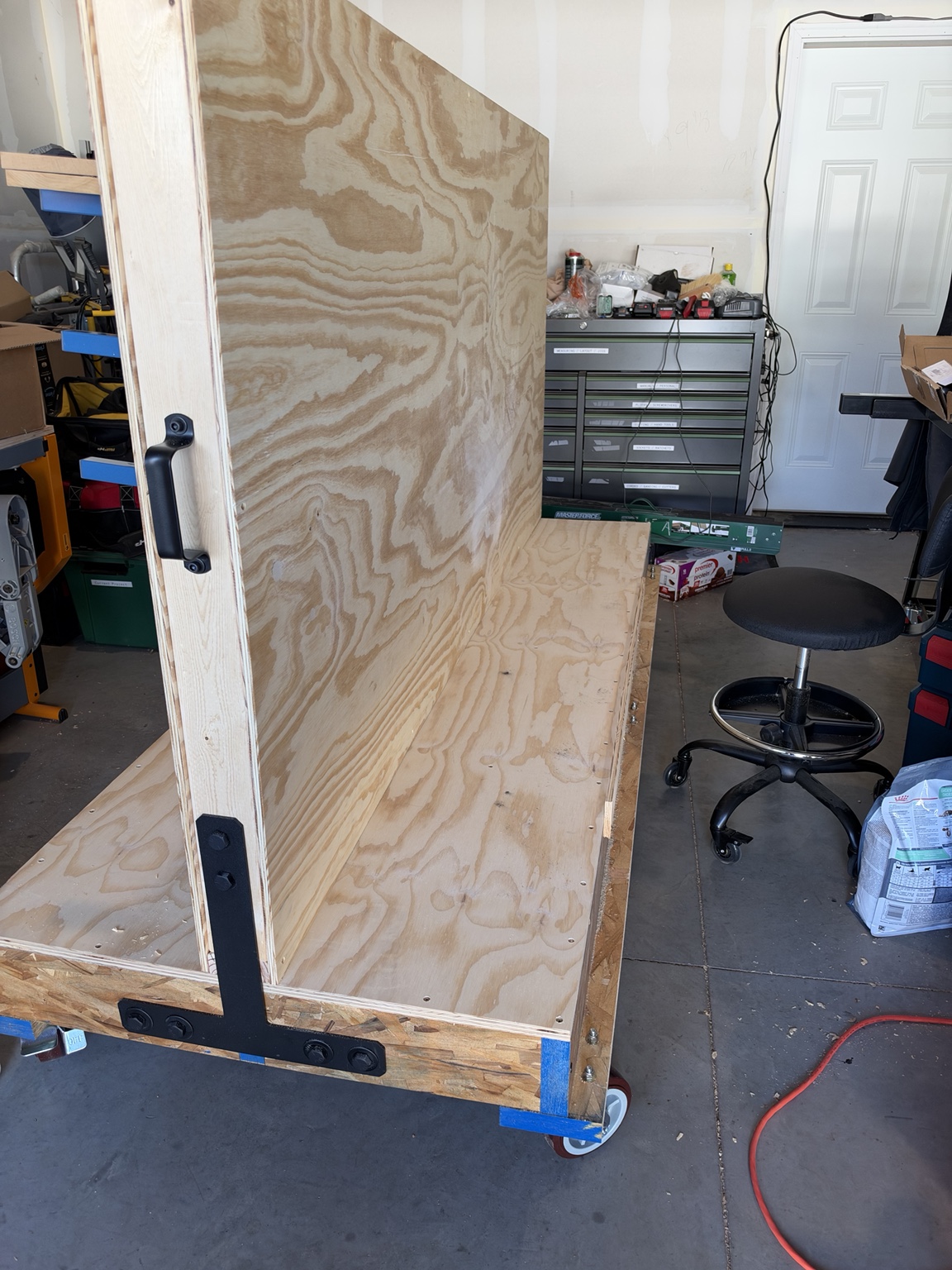 Double-skinned center wall and open plywood storage deck