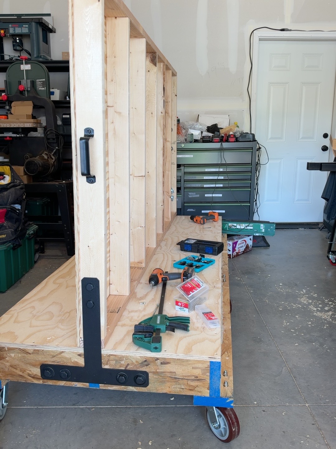 Exposed wall uprights with handle and T-strap hardware before the second skin is installed