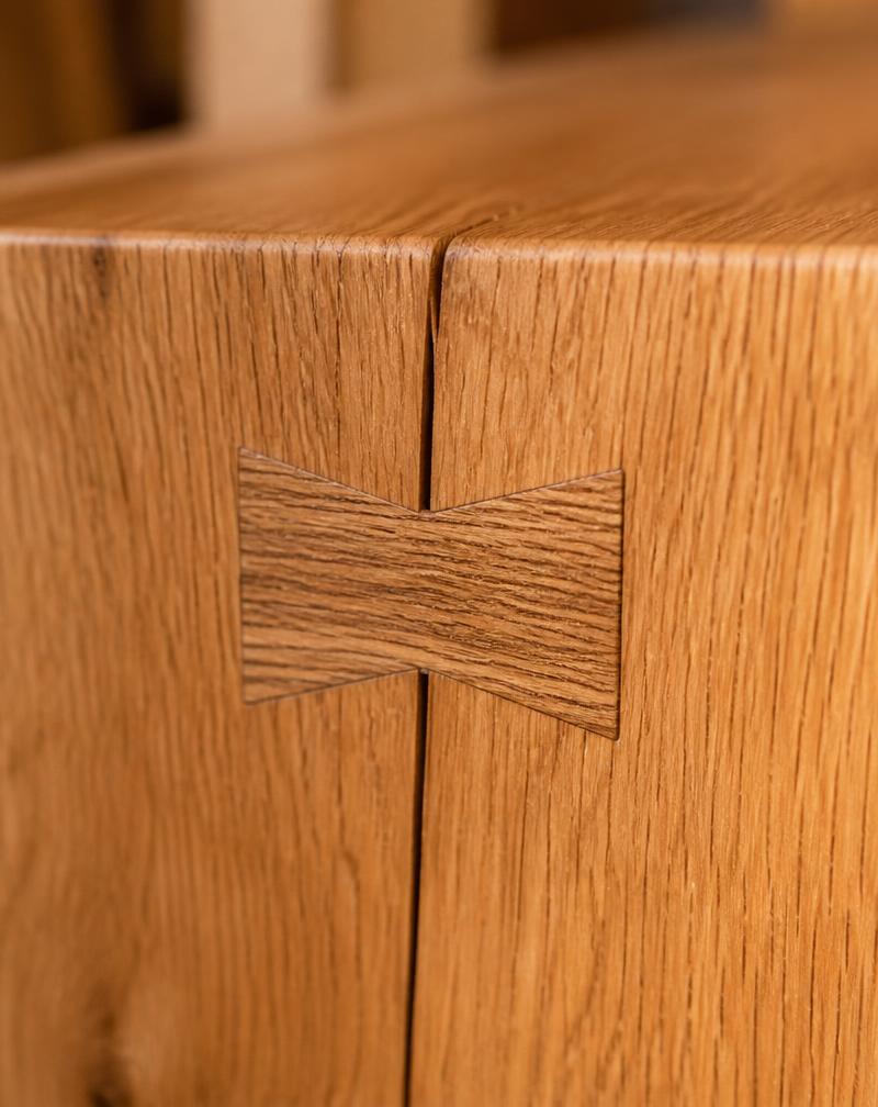 Detail shot of a butterfly joinery in light oak